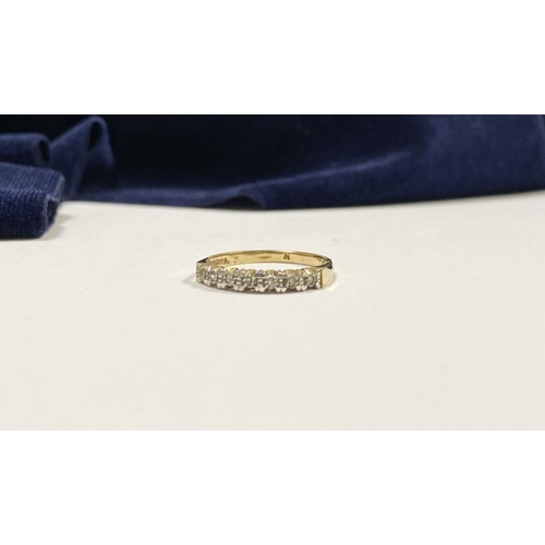 80 - A 9CT YELLOW GOLD SEVEN STONE DIAMOND RING, with seven round cut diamonds in raised illusion setting... 