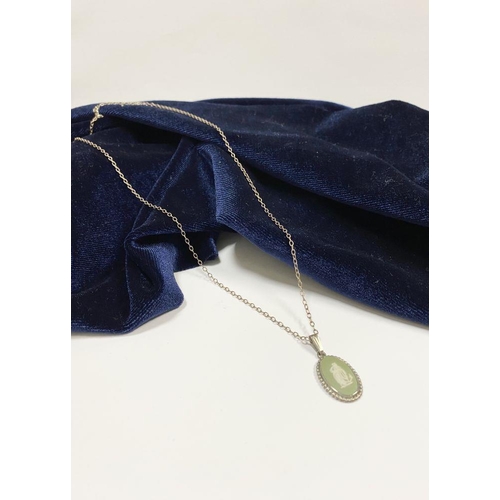 86 - A CASED WEDGWOOD JASPERWARE PENDANT NECKLACE, pendant in green and white mounted on silver with rope... 