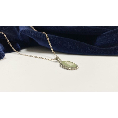 86 - A CASED WEDGWOOD JASPERWARE PENDANT NECKLACE, pendant in green and white mounted on silver with rope... 