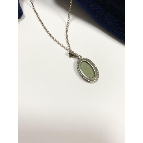 86 - A CASED WEDGWOOD JASPERWARE PENDANT NECKLACE, pendant in green and white mounted on silver with rope... 