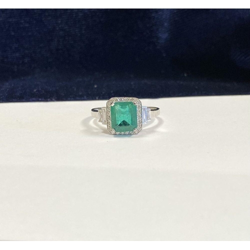 9 - AN 18CT WHITE GOLD COLOMBIAN EMERALD & DIAMOND RING, with a magnificent emerald cut natural Colombia... 