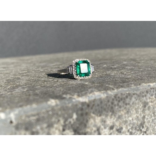 9 - AN 18CT WHITE GOLD COLOMBIAN EMERALD & DIAMOND RING, with a magnificent emerald cut natural Colombia... 