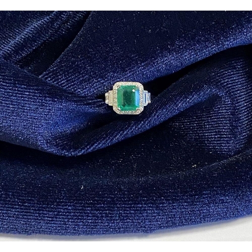 9 - AN 18CT WHITE GOLD COLOMBIAN EMERALD & DIAMOND RING, with a magnificent emerald cut natural Colombia... 