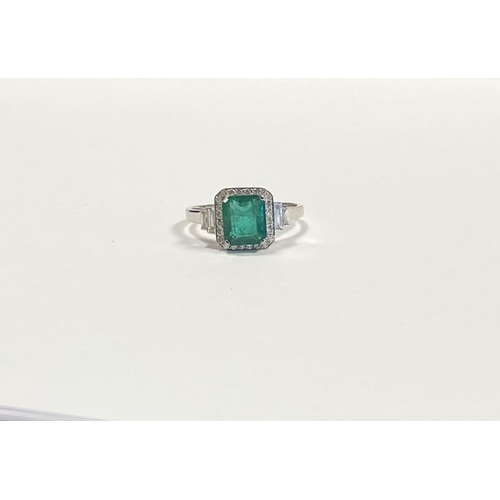 9 - AN 18CT WHITE GOLD COLOMBIAN EMERALD & DIAMOND RING, with a magnificent emerald cut natural Colombia... 