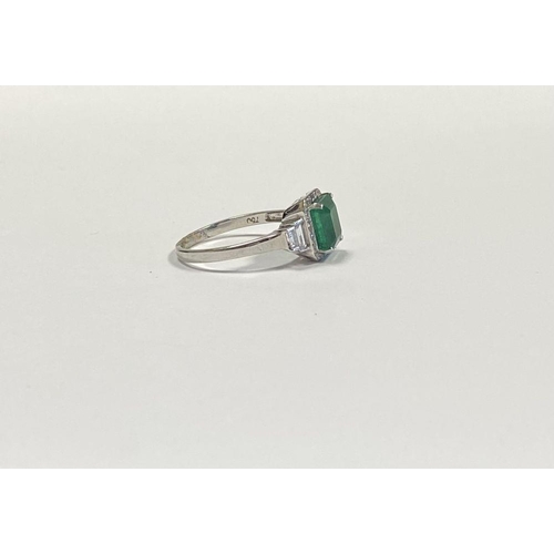 9 - AN 18CT WHITE GOLD COLOMBIAN EMERALD & DIAMOND RING, with a magnificent emerald cut natural Colombia... 