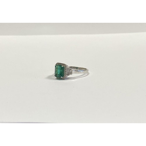 9 - AN 18CT WHITE GOLD COLOMBIAN EMERALD & DIAMOND RING, with a magnificent emerald cut natural Colombia... 