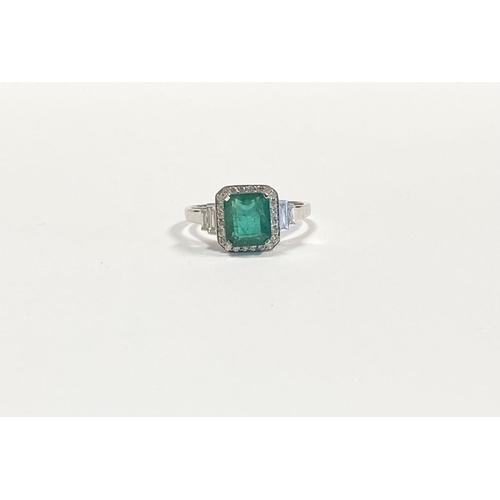 9 - AN 18CT WHITE GOLD COLOMBIAN EMERALD & DIAMOND RING, with a magnificent emerald cut natural Colombia... 