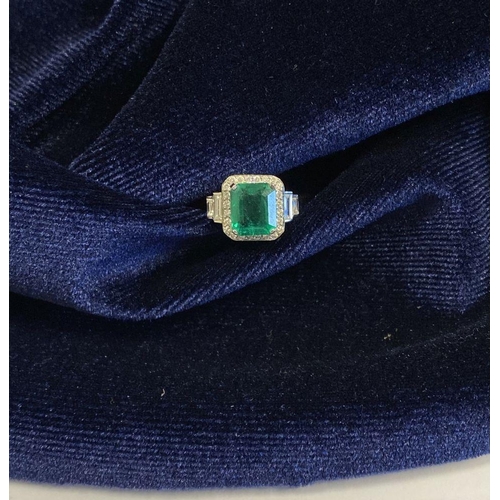 9 - AN 18CT WHITE GOLD COLOMBIAN EMERALD & DIAMOND RING, with a magnificent emerald cut natural Colombia... 