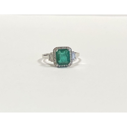 9 - AN 18CT WHITE GOLD COLOMBIAN EMERALD & DIAMOND RING, with a magnificent emerald cut natural Colombia... 