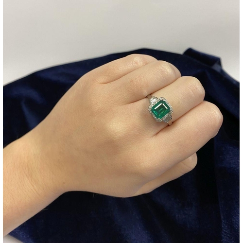 9 - AN 18CT WHITE GOLD COLOMBIAN EMERALD & DIAMOND RING, with a magnificent emerald cut natural Colombia... 