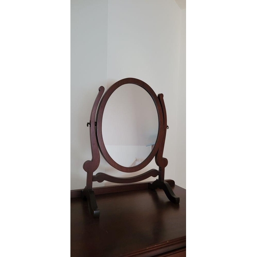 90 - A PAIR OF SWING MIRRORS, the oval shaped mirrors are held between a pair of scroll shaped uprights, ... 