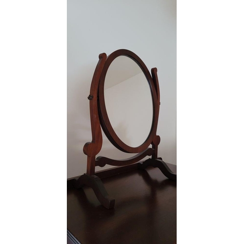 90 - A PAIR OF SWING MIRRORS, the oval shaped mirrors are held between a pair of scroll shaped uprights, ... 