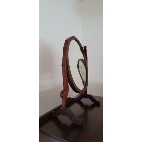 90 - A PAIR OF SWING MIRRORS, the oval shaped mirrors are held between a pair of scroll shaped uprights, ... 