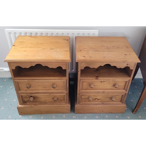 92 - A GOOD PAIR OF PINE BEDSIDE LOCKERS / LAMP LOCKERS, each with an open shelf having a shaped skirt to... 