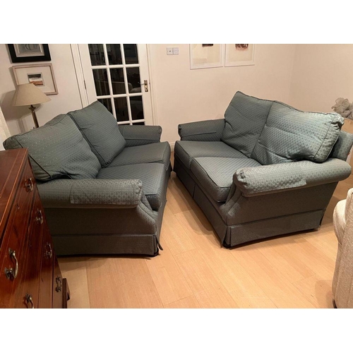 95 - A PAIR OF GOOD QUALITY TWO-SEATER COUCHES, each with cushioned back & seats and a slanted front to t... 