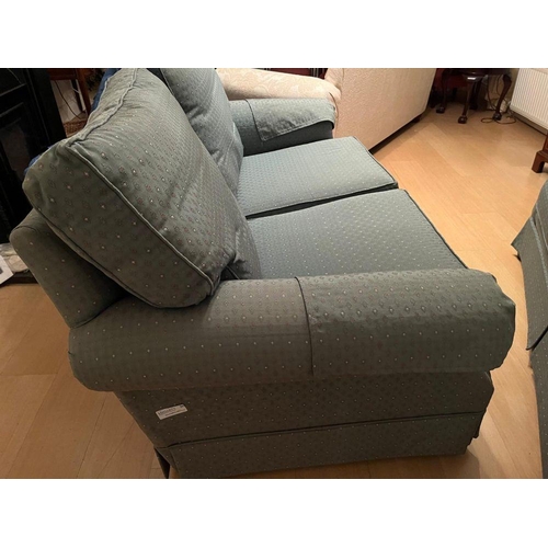 95 - A PAIR OF GOOD QUALITY TWO-SEATER COUCHES, each with cushioned back & seats and a slanted front to t... 