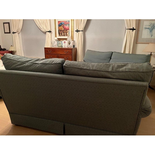 95 - A PAIR OF GOOD QUALITY TWO-SEATER COUCHES, each with cushioned back & seats and a slanted front to t... 