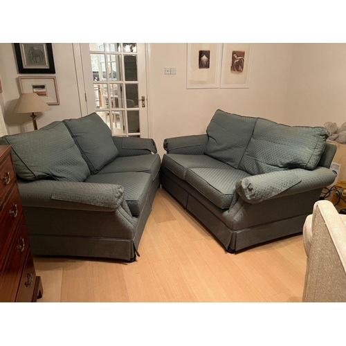 95 - A PAIR OF GOOD QUALITY TWO-SEATER COUCHES, each with cushioned back & seats and a slanted front to t... 