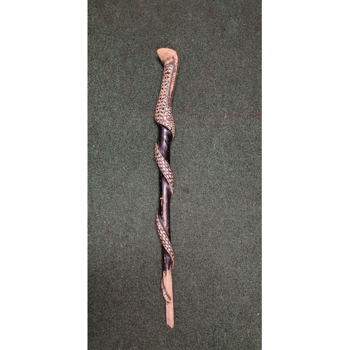 254 - AN UNUSUAL MOTHER OF PEARL & BONE INLAID WALKING STICK / STAFF IN THE FORM OF A SNAKE, the head of t... 