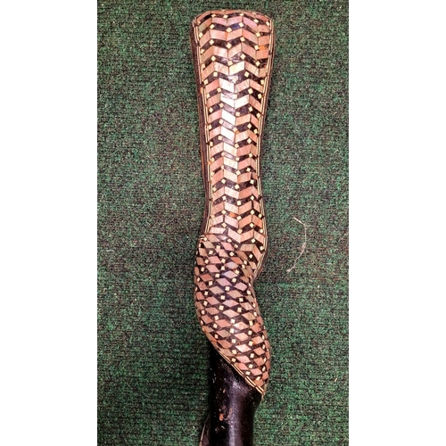 254 - AN UNUSUAL MOTHER OF PEARL & BONE INLAID WALKING STICK / STAFF IN THE FORM OF A SNAKE, the head of t... 