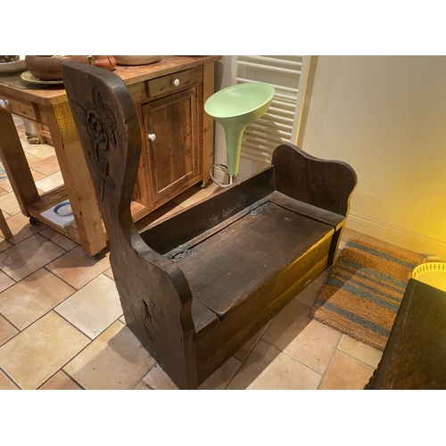 259 - A PAIR OF CARVED ANTIQUE MUNK STYLE BENCHES, with wrought iron hinged lift top cabinet lids to the s... 