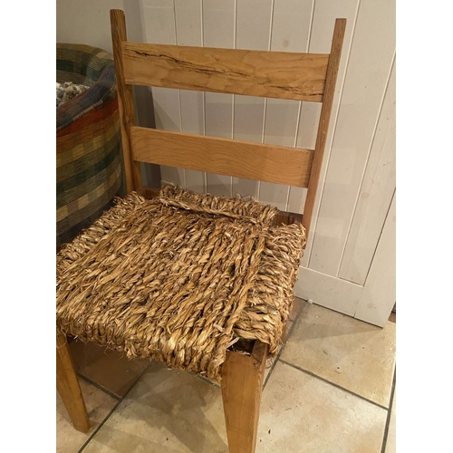 261 - A NEATLY SIZED CONTEMPORARY SUGAN STYLE CHAIR, with double bar rest to the back held up between two ... 