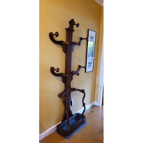 264 - A 19TH CENTURY MAHOGANY COAT TREE, with a central column and four tree branches; each with turned wo... 