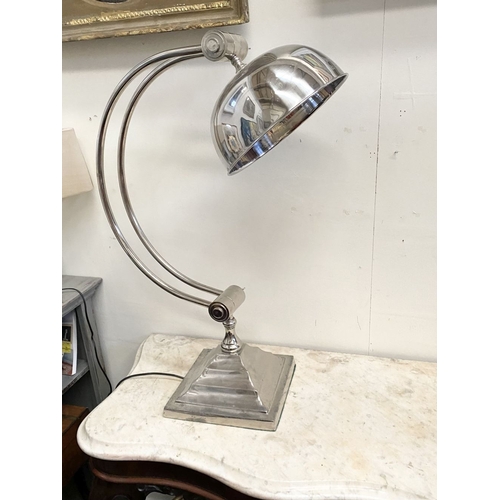 100 - A 1960s CHROME TABLE LAMP with dome shade on adjustable arm support raised on a square stepped base.... 