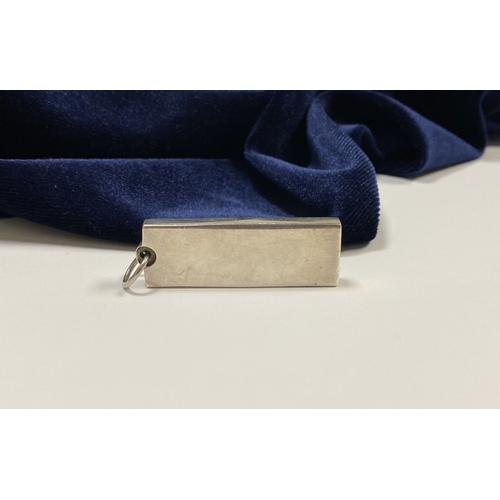 104 - A LARGE STERLING SILVER INGOT PENDANT, Hallmarked CJ, London c.1977. Dimensions: 4.3cm high x 1.5cm ... 