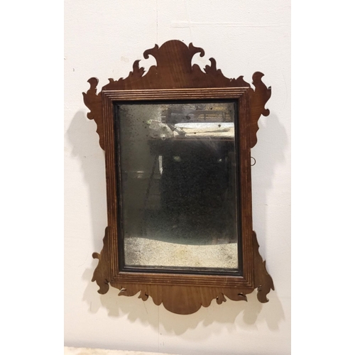 110 - AN ANTIQUE NEATLY SIZED CHIPPENDALE STYLE WALL MIRROR, typical scrolling foliate design to the frame... 
