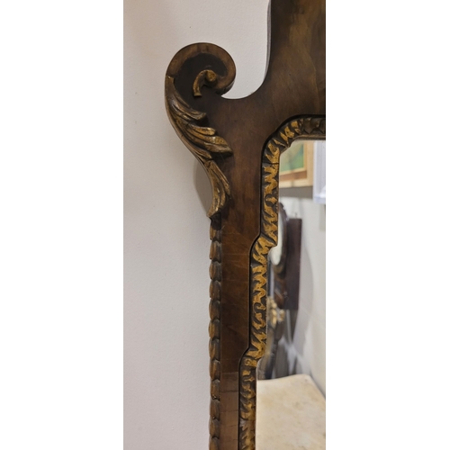 113 - A GOOD QUALITY EARLY 20TH CENTURY GEORGIAN STYLE WALNUT & GILTWOOD MIRROR, lovely scroll shape to th... 