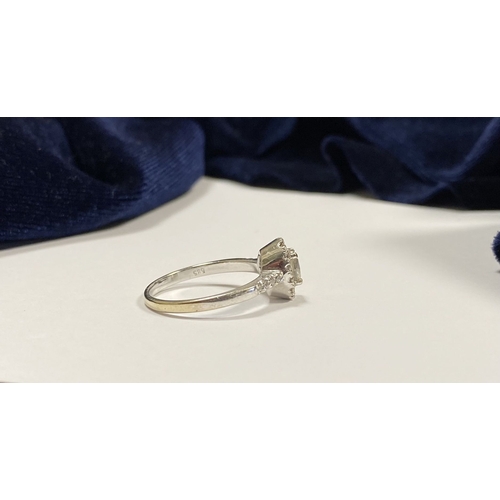 14 - A STUNNING 14CT WHITE GOLD DIAMOND CLUSTER RING, with central oval brilliant cut diamond, weight: .5... 