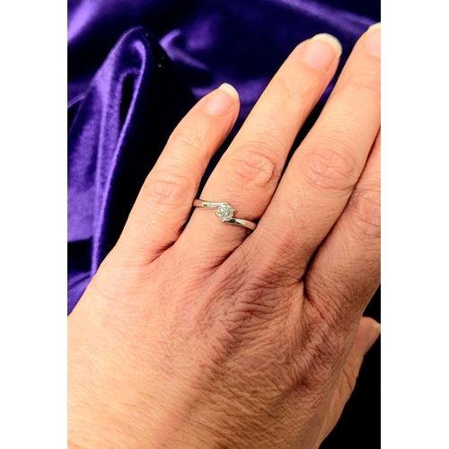 15 - A BEAUTIFUL 18CT WHITE GOLD DIAMOND SOLITAIRE RING, with a crossover setting, 18ct white gold band. ... 