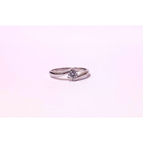 15 - A BEAUTIFUL 18CT WHITE GOLD DIAMOND SOLITAIRE RING, with a crossover setting, 18ct white gold band. ... 