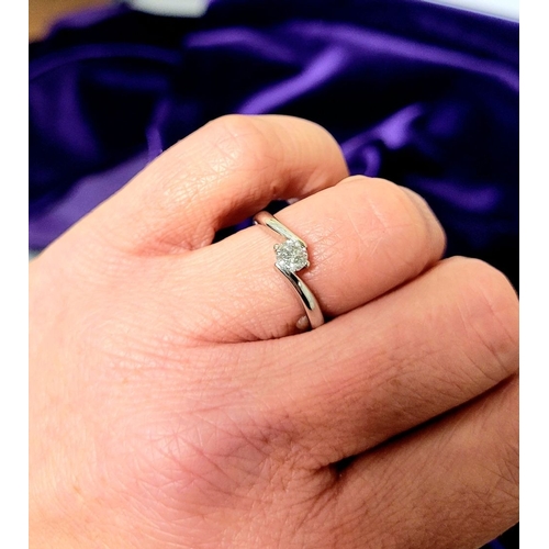 15 - A BEAUTIFUL 18CT WHITE GOLD DIAMOND SOLITAIRE RING, with a crossover setting, 18ct white gold band. ... 