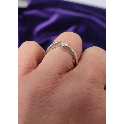 15 - A BEAUTIFUL 18CT WHITE GOLD DIAMOND SOLITAIRE RING, with a crossover setting, 18ct white gold band. ... 