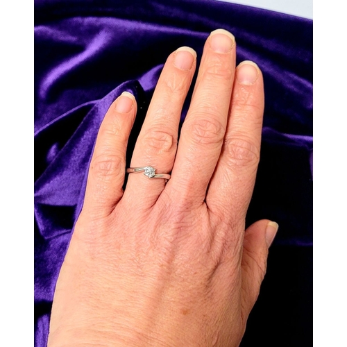 15 - A BEAUTIFUL 18CT WHITE GOLD DIAMOND SOLITAIRE RING, with a crossover setting, 18ct white gold band. ... 