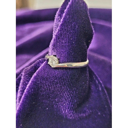 15 - A BEAUTIFUL 18CT WHITE GOLD DIAMOND SOLITAIRE RING, with a crossover setting, 18ct white gold band. ... 