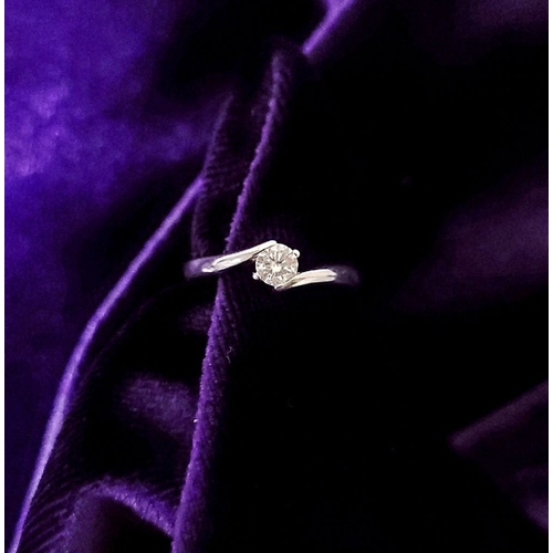 15 - A BEAUTIFUL 18CT WHITE GOLD DIAMOND SOLITAIRE RING, with a crossover setting, 18ct white gold band. ... 