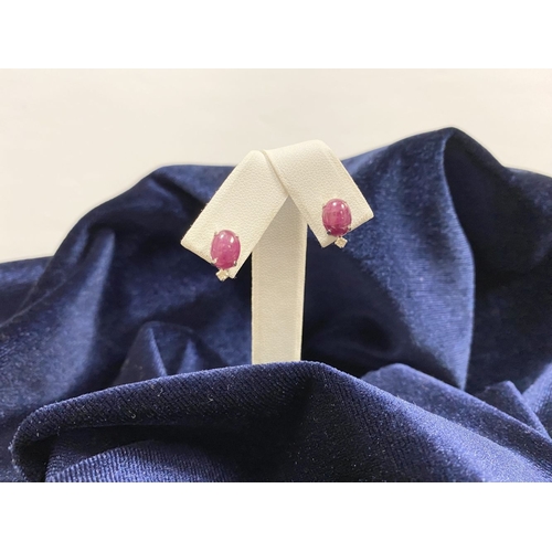16 - A PAIR OF 18CT WHITE GOLD RUBY & DIAMOND STUD EARRINGS, with oval cut rubies in four prong claw sett... 