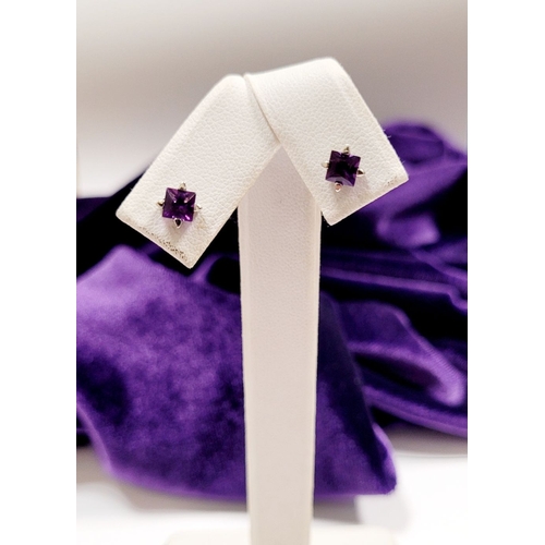 23 - A PRETTY PAIR OF 18CT WHITE GOLD PRINCESS CUT AMETHYST STUD EARRINGS, a gorgeous bright purple tone ... 