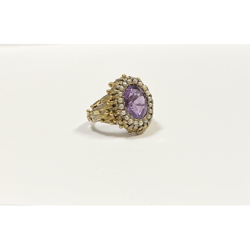 25 - A STUNNING ANTIQUE 18CT GOLD AMETHYST & SEED PEARL CLUSTER RING, with central large oval cut amethys... 