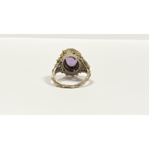 25 - A STUNNING ANTIQUE 18CT GOLD AMETHYST & SEED PEARL CLUSTER RING, with central large oval cut amethys... 
