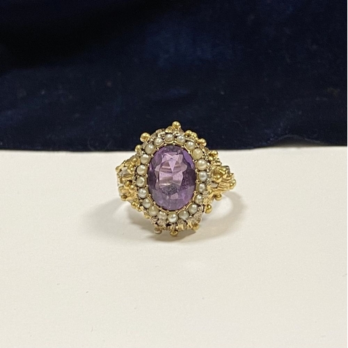 25 - A STUNNING ANTIQUE 18CT GOLD AMETHYST & SEED PEARL CLUSTER RING, with central large oval cut amethys... 