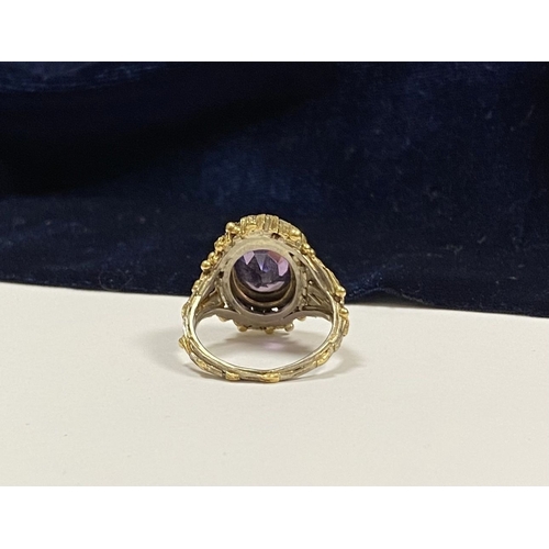 25 - A STUNNING ANTIQUE 18CT GOLD AMETHYST & SEED PEARL CLUSTER RING, with central large oval cut amethys... 