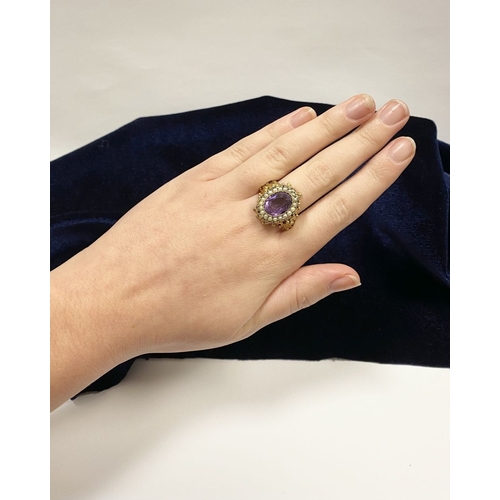 25 - A STUNNING ANTIQUE 18CT GOLD AMETHYST & SEED PEARL CLUSTER RING, with central large oval cut amethys... 