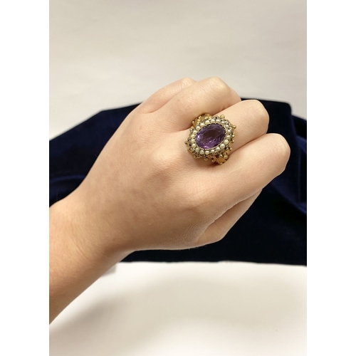 25 - A STUNNING ANTIQUE 18CT GOLD AMETHYST & SEED PEARL CLUSTER RING, with central large oval cut amethys... 