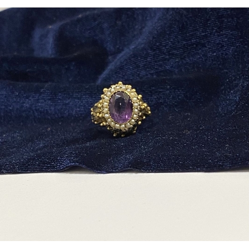 25 - A STUNNING ANTIQUE 18CT GOLD AMETHYST & SEED PEARL CLUSTER RING, with central large oval cut amethys... 