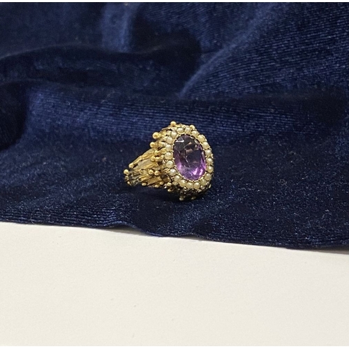 25 - A STUNNING ANTIQUE 18CT GOLD AMETHYST & SEED PEARL CLUSTER RING, with central large oval cut amethys... 
