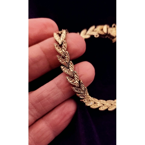 30 - A BEAUTIFUL LEAF DESIGN 14CT YELLOW GOLD LINK BRACELET, lovely movement to the piece, marked 14K. Me... 